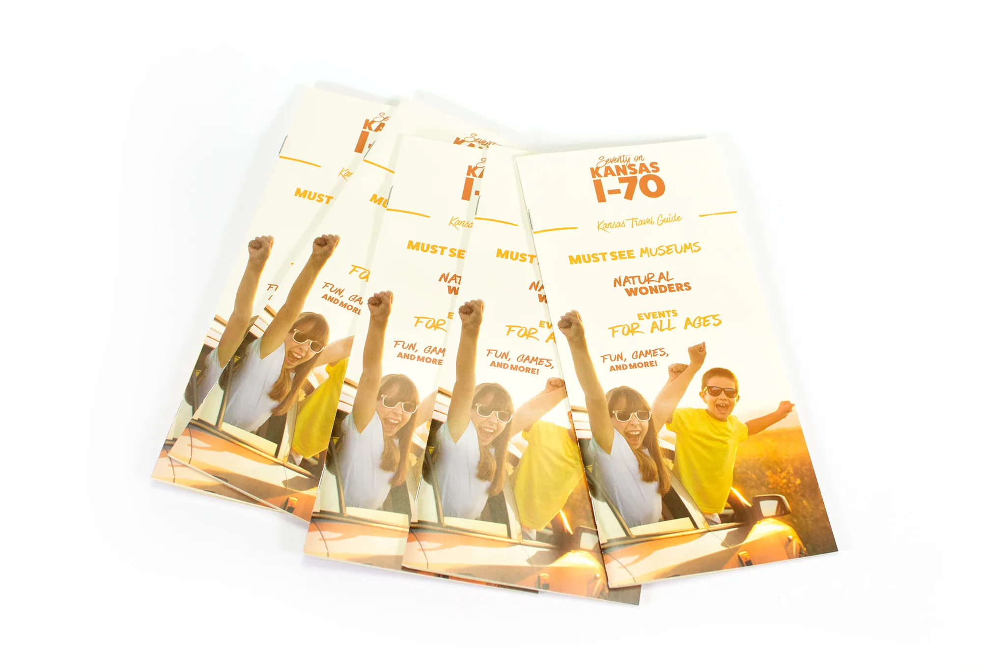 A stack of travel brochures spread out into a fan orientation.