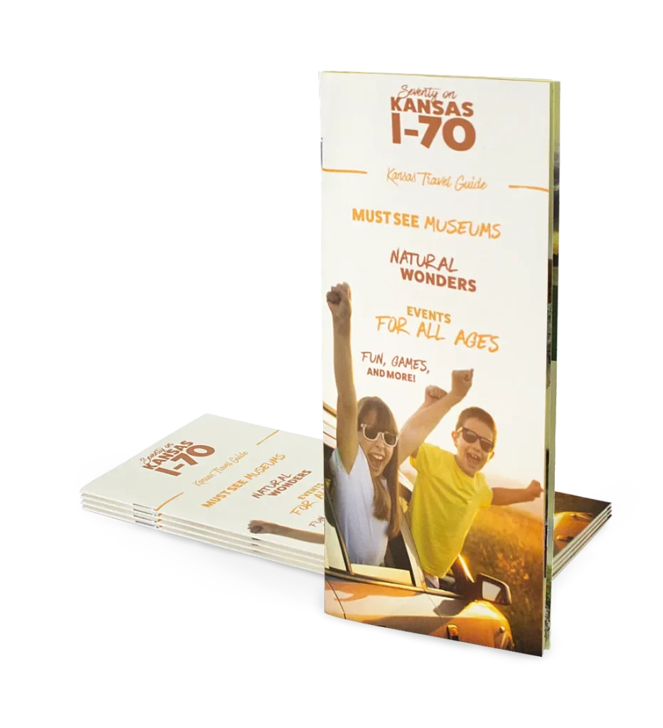 A travel brochure with a stack of copies.