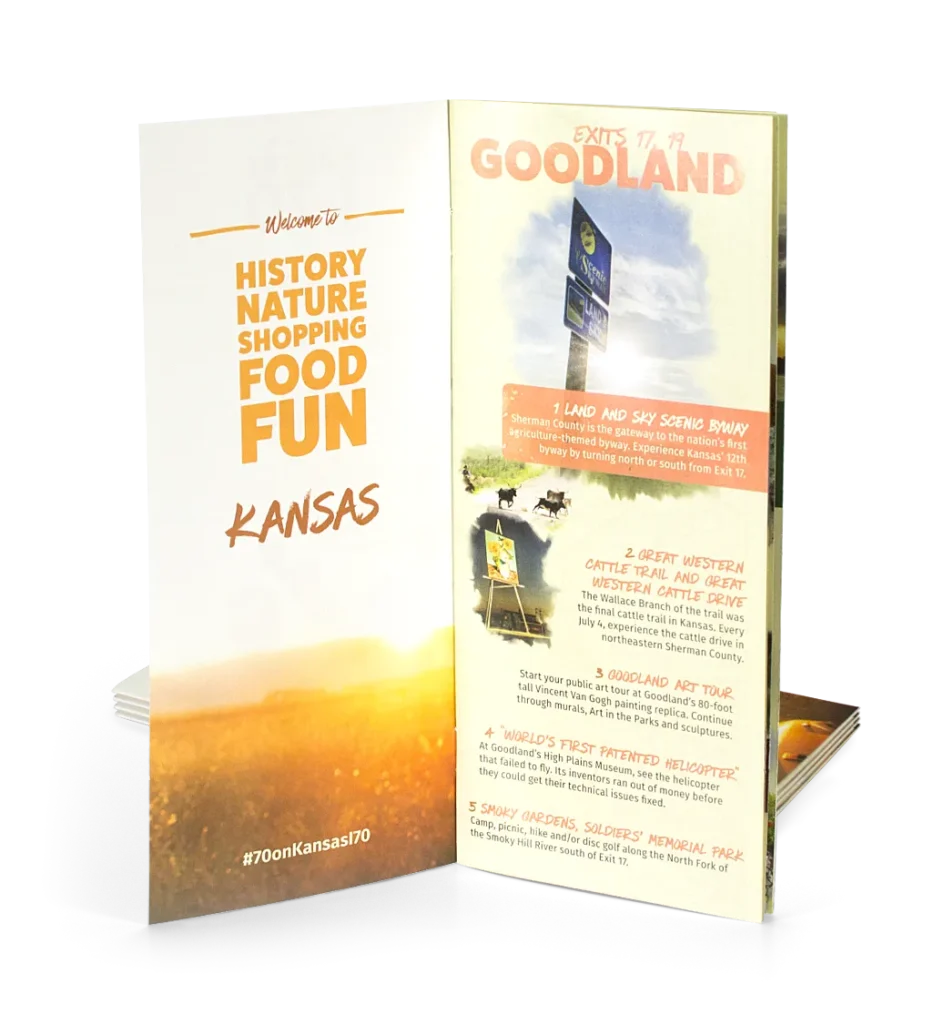 A travel brochure opened to the first page with a stack of copies behind.