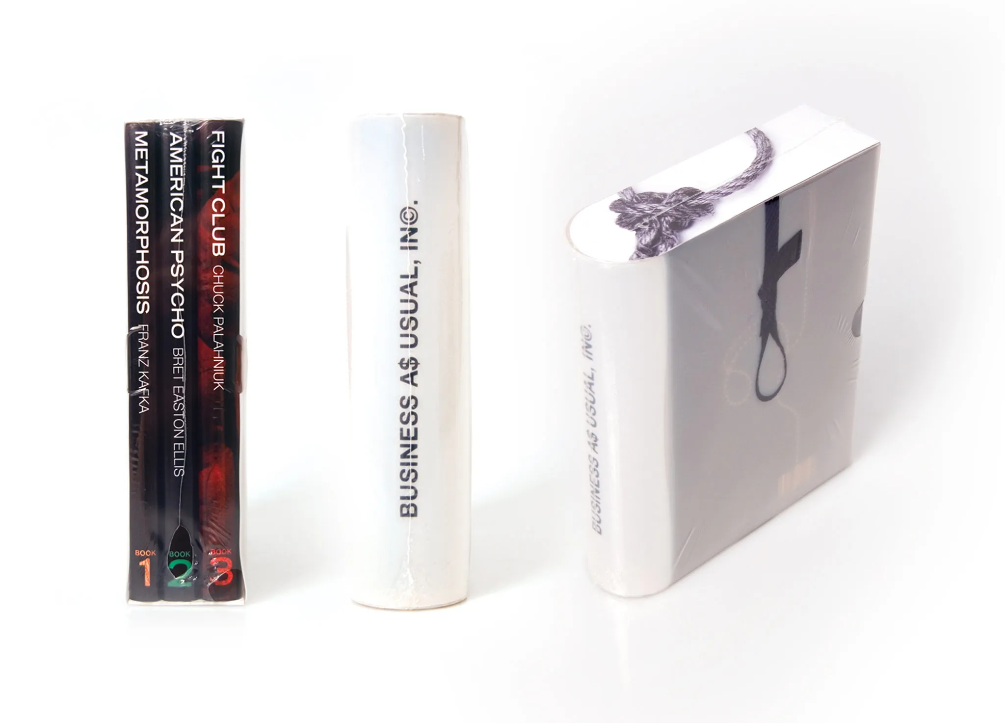 A packaged collection of three books is shown from the ends, spines, and a three-quarter view.