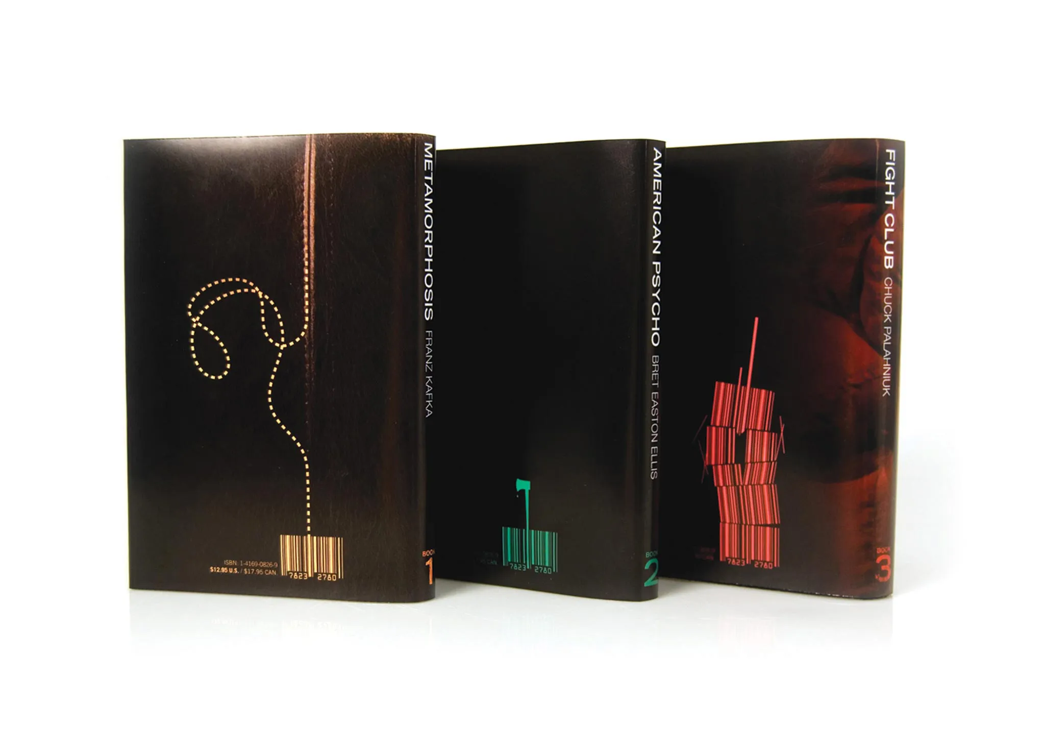 Three books standing upright showing the back covers.