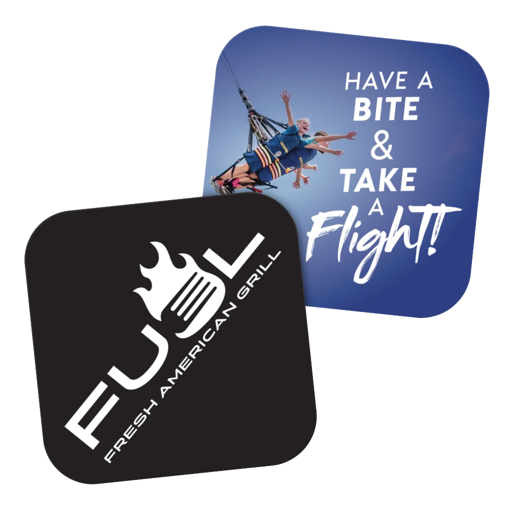 Two coasters with promotional graphics promoting the Fuel restaurant and a related attraction.