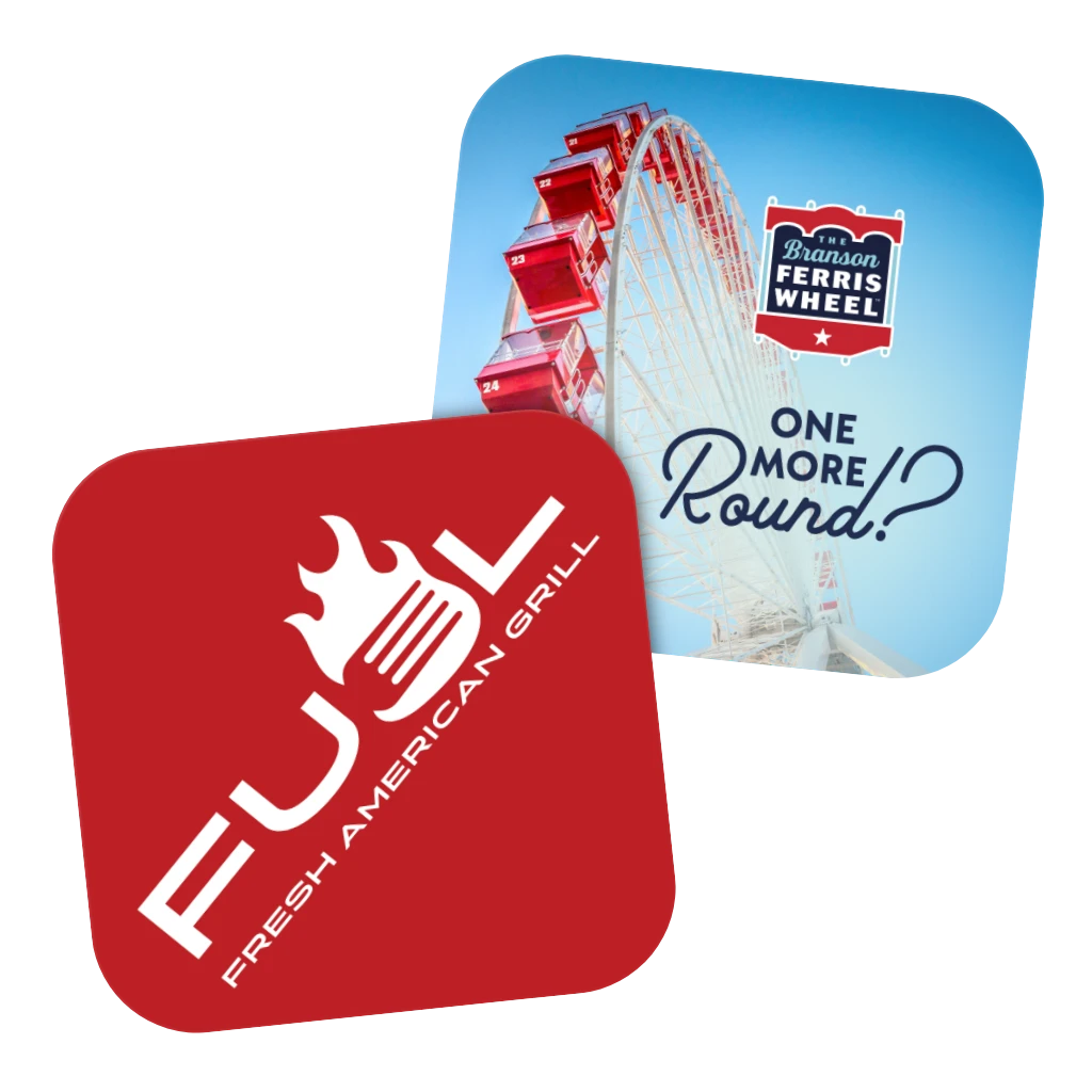 Two coasters with promotional graphics promoting the Fuel restaurant and a related attraction.